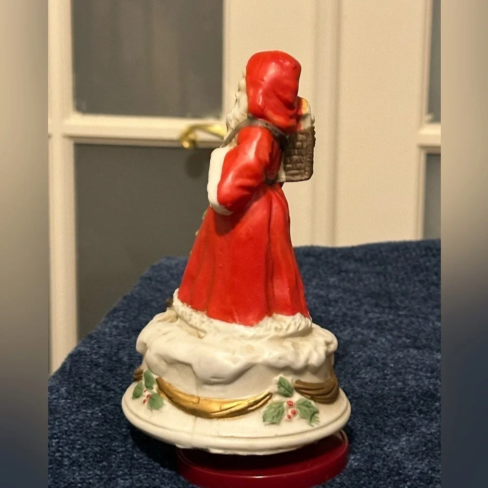 Revolving porcelain Santa musical figure plays Santa Claus is Coming to Town.